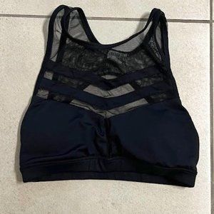 Black sports bra with mesh cutouts, open back, size S